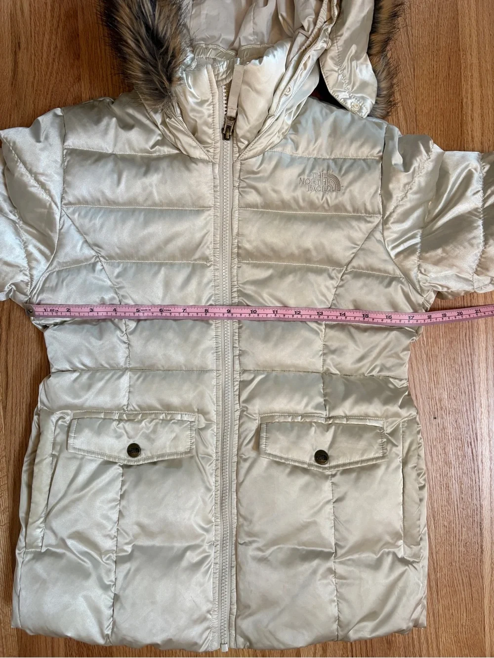 The North Face Girls champagne-colored puffer jacket